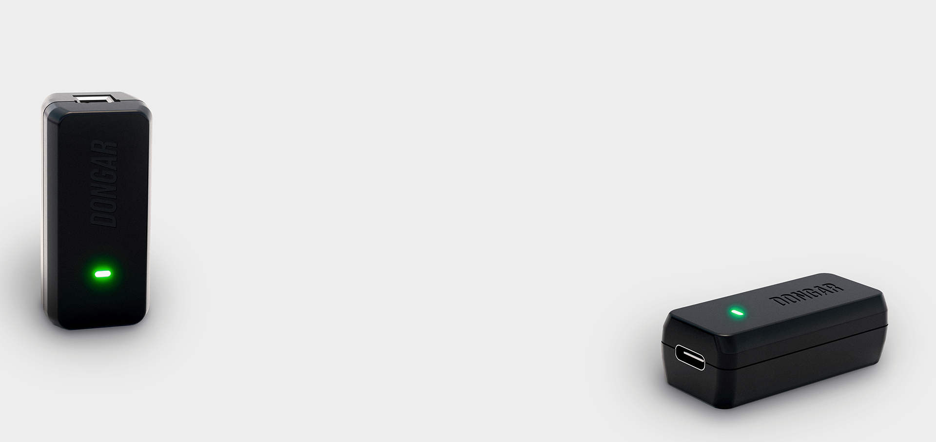 Two black Dongar Classic Modules with green lights on a white background